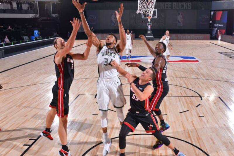 ORLANDO, FL - AUGUST 6: Kelly Olynyk #9 of the Miami Heat, Giannis Antetokounmpo #34 of the Milwaukee Bucks, and Duncan Robinson #55 of the Miami Heat fight for the rebound on August 6, 2020 at The Arena at ESPN Wide World of Sports in Orlando, Florida. NOTE TO USER: User expressly acknowledges and agrees that, by downloading and/or using this Photograph, user is consenting to the terms and conditions of the Getty Images License Agreement. Mandatory Copyright Notice: Copyright 2020 NBAE (Photo by Jesse D. Garrabrant/NBAE via Getty Images)