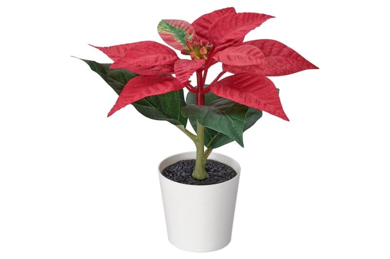 Planta artificial en tono rojo vibrante, perfecta para agregar un toque festivo en estas fechas de celebración.