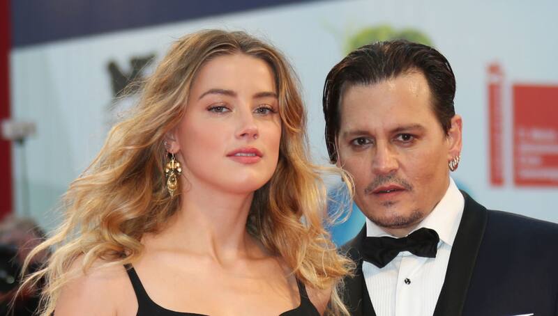 Actors Johnny Depp and Amber Heard attending the film Black Mass during the 72nd edition of the Venice Film Festival in Venice, Italy, Friday, Sept. 4, 2015.