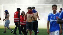 El duro castigo que arriesga la U tras la invasión de los hinchas en el Clásico Universitario