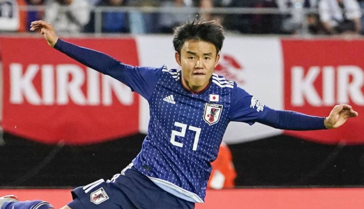 Japan's Takefusa Kubo, top, attempts to score a goal over El Salvador's Roberto Dominguez during a friendly soccer match in Rifu, Miyagi prefecture, northern Japan, Sunday, June 9, 2019. (Kyodo News via AP)