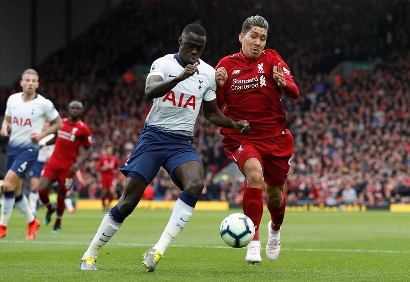 Soccer Football - Premier League - Liverpool v Tottenham Hotspur - Anfield, Liverpool, Britain - March 31, 2019 Tottenham's Davinson Sanchez in action with Liverpool's Roberto Firmino Action Images via Reuters/Paul Childs EDITORIAL USE ONLY. No use with unauthorized audio, video, data, fixture lists, club/league logos or "live" services. Online in-match use limited to 75 images, no video emulation. No use in betting, games or single club/league/player publications. Please contact your account representative for further details.
