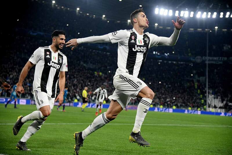 Soccer Football - Champions League - Round of 16 Second Leg - Juventus v Atletico Madrid - Allianz Stadium, Turin, Italy - March 12, 2019 Juventus' Cristiano Ronaldo celebrates scoring their third goal to complete his hat-trick with Emre Can REUTERS/Alberto Lingria
