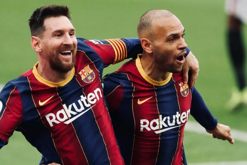 Martin Braithwaite junto a Lionel Messi en el FC Barcelona.