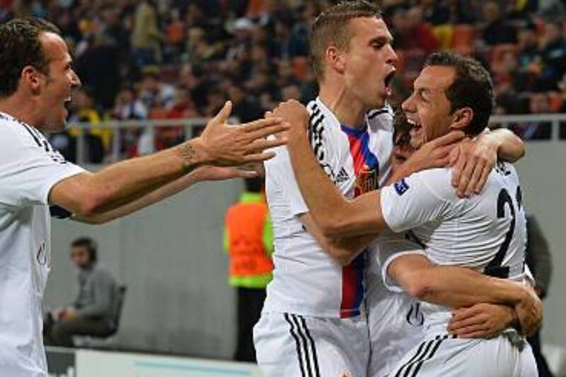 Marcelo Diaz (R) of FC Basel celebrates scoring with his teammates during the UEFA Champions League Group E football match FC Steaua Bucuresti vs FC Basel 1893 in Bucharest, Romania on October 22, 2013. AFP PHOTO / DANIEL MIHAILESCU (Photo credit should read DANIEL MIHAILESCU/AFP via Getty Images