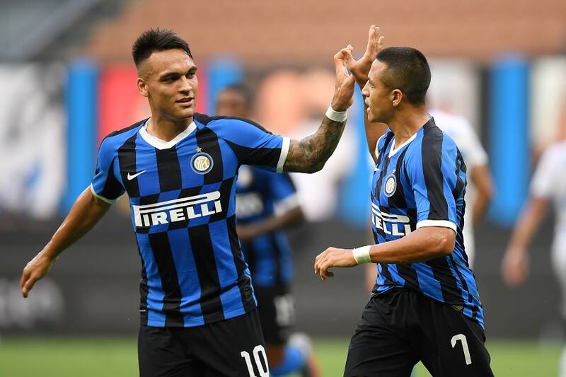 Soccer Football - Serie A - Inter Milan v Brescia - San Siro, Milan, Italy - July 1, 2020 Inter Milan's Alexis Sanchez celebrates scoring their second goal with Lautaro Martinez, as play resumes behind closed doors following the outbreak of the coronavirus disease (COVID-19) REUTERS/Daniele Mascolo