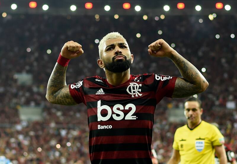 Flamengo's Gabriel Barbosa (R) celebrates with teammates after scoring against Gremio during their Copa Libertadores second leg semi-final football match, at Maracana stadium in Rio de Janeiro, Brazil, on October 23, 2019. (Photo by MAURO PIMENTEL / AFP)