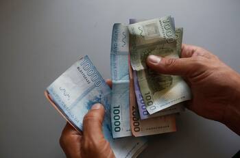 Consulta con tu RUT si tienes pendiente de cobro el bono de $100.000 para días de lluvia y frío