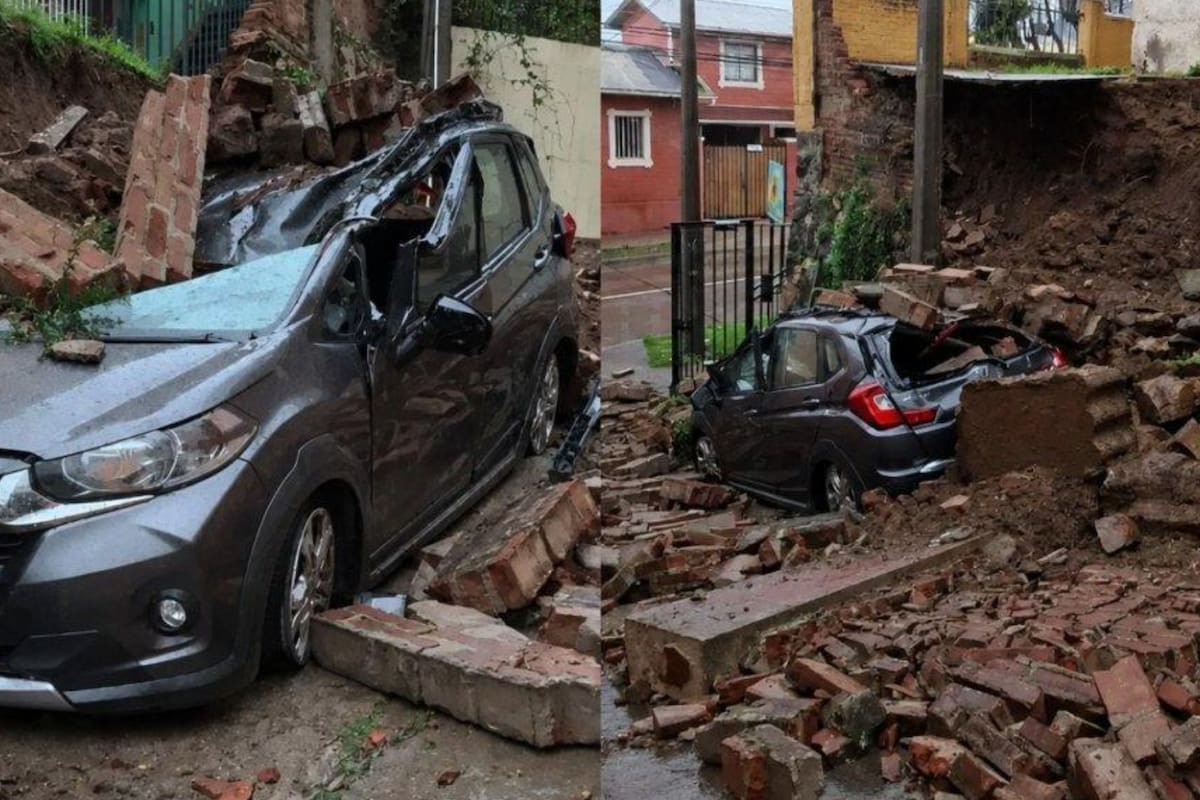 Muro cayó sobre un automóvil estacionado debido a un desprendimiento del terreno. Foto: ATON.