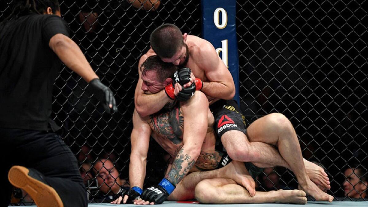 Oct 6, 2018; Las Vegas, NV, USA; Khabib Nurmagomedov (red gloves) fights Conor McGregor (blue gloves) during UFC 229 at T-Mobile Arena. Mandatory Credit: Stephen R. Sylvanie-USA TODAY Sports