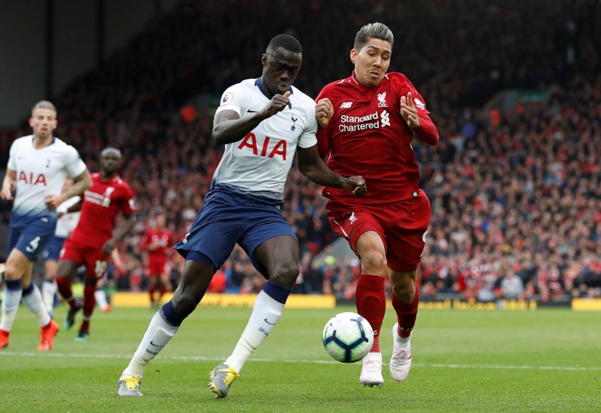 Soccer Football - Premier League - Liverpool v Tottenham Hotspur - Anfield, Liverpool, Britain - March 31, 2019 Tottenham's Davinson Sanchez in action with Liverpool's Roberto Firmino Action Images via Reuters/Paul Childs EDITORIAL USE ONLY. No use with unauthorized audio, video, data, fixture lists, club/league logos or "live" services. Online in-match use limited to 75 images, no video emulation. No use in betting, games or single club/league/player publications. Please contact your account representative for further details.